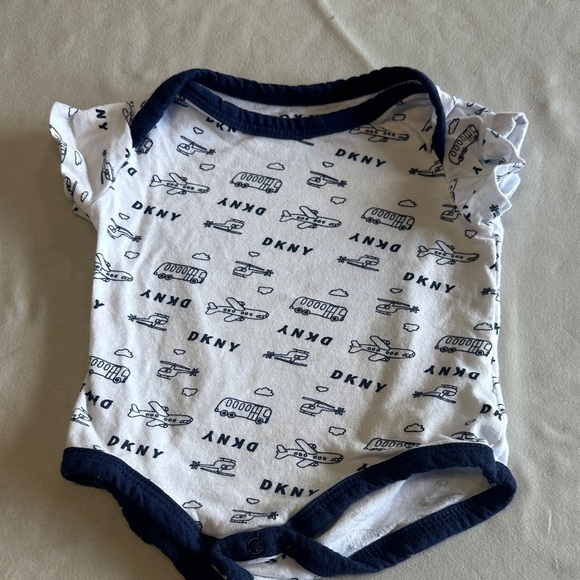 DKNY - White and Navy Baby Onesie with Airplane Design - Picture 1 of 3